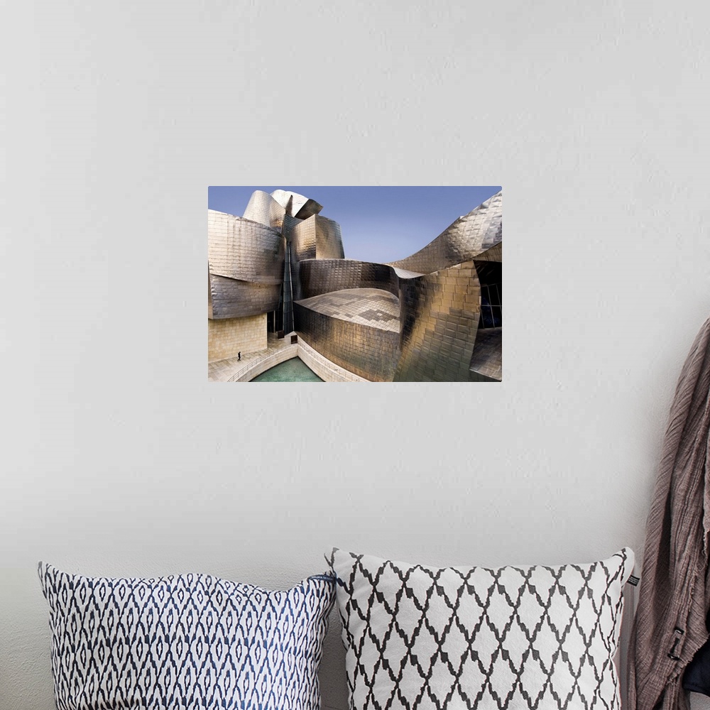 A bohemian room featuring The impressive curves of the titanium and glass walls of the Guggenheim Museum in Bilbao, Spain, ...