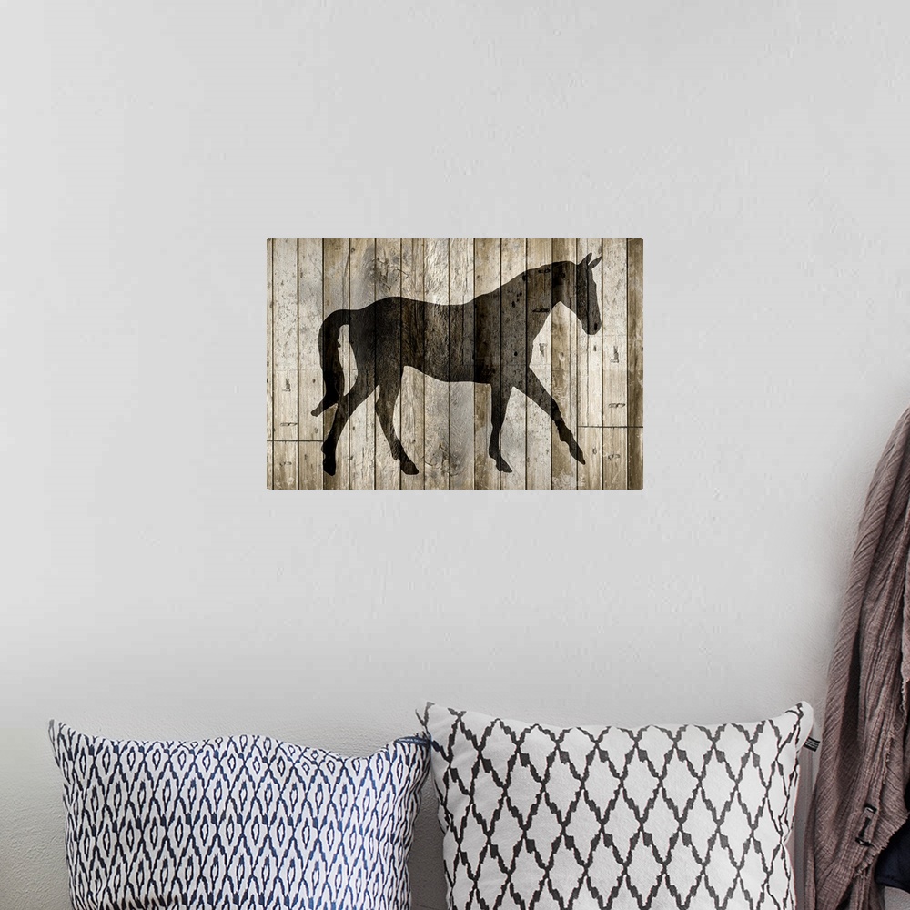 A bohemian room featuring A silhouette of a horse on a rustic wood paneled background.