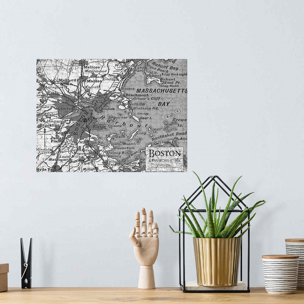 A bohemian room featuring Rustic contemporary art map of Boston districts, in black and white.