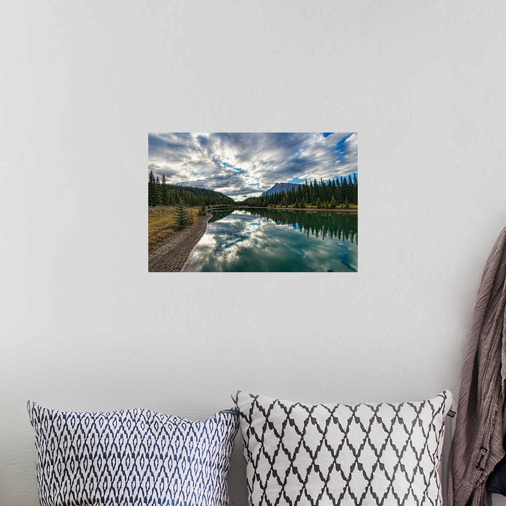A bohemian room featuring Reflective and picturesque Cascade Ponds just outside of Banff, in Banff National Park, Canadian ...