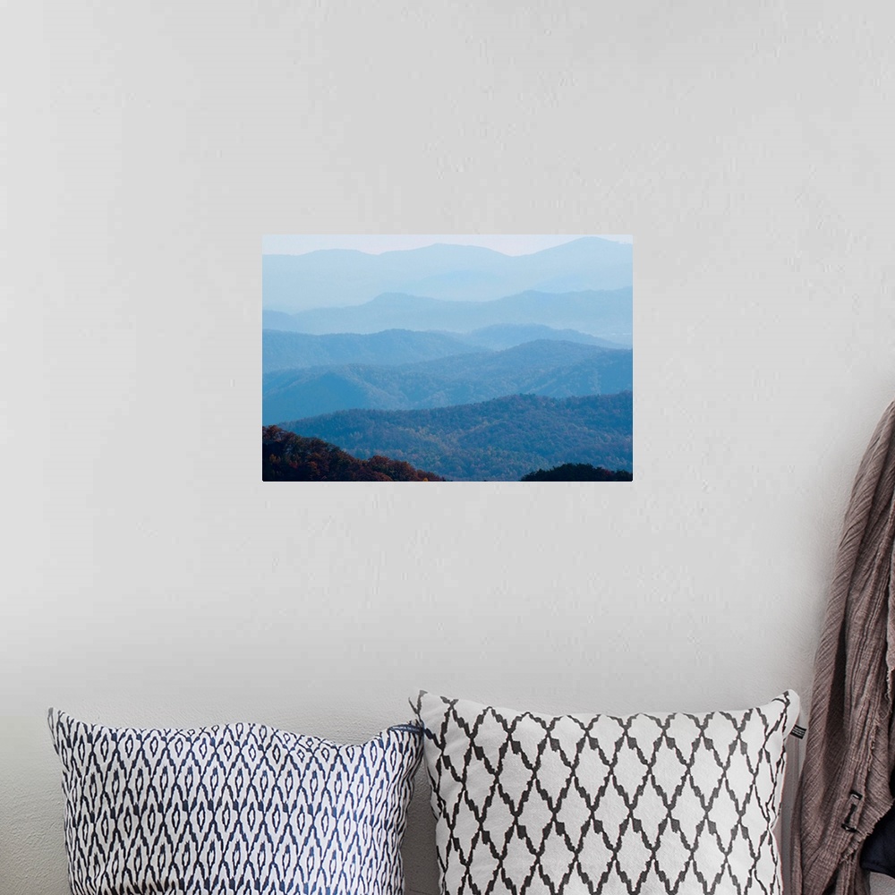 A bohemian room featuring A bluish haze over the Blue Ridge Mountains at sunset.