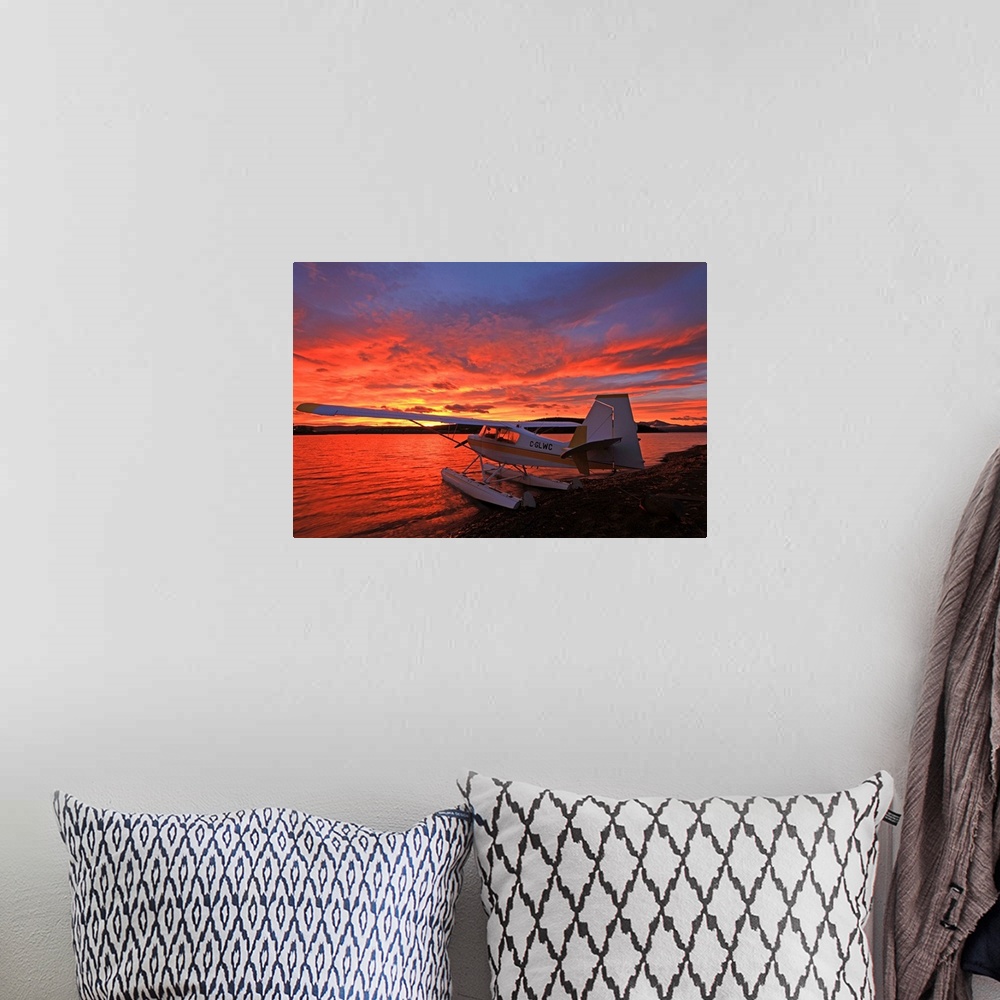 A bohemian room featuring A Float Plane Facing The Sunrise Over Teslin Lake, Yukon, Canada