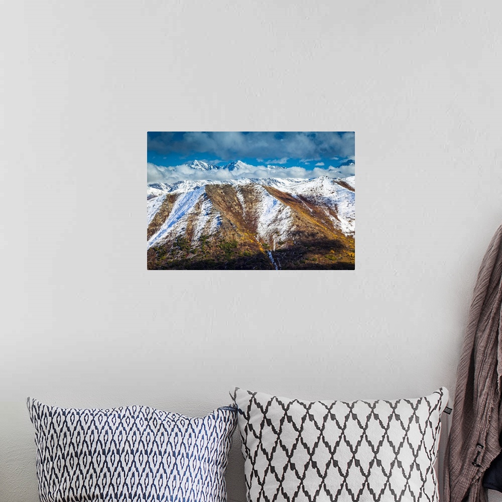 A bohemian room featuring Fall coloured Chugach Mountains dusted with snow, jagged peaks in the background. Chugach State P...