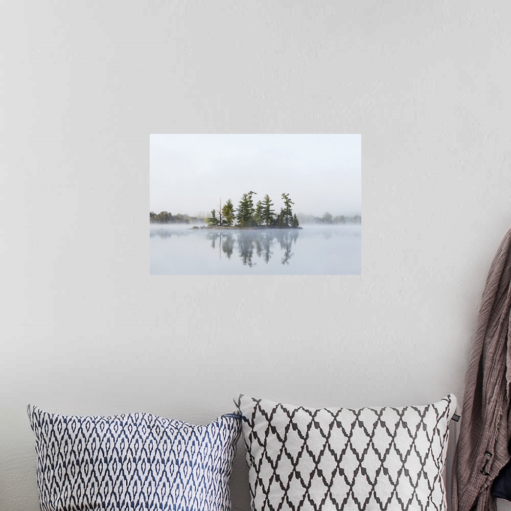 A bohemian room featuring Fog shrouds a small island on Turtle Lake in Ontarios Muskoka Region, near Rosseau; Ontario, Canada