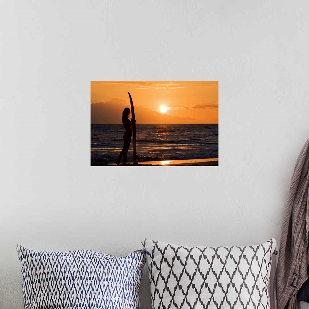 A bohemian room featuring Hawaii, Female Surfer On Beach Silhouetted Against Orange Sunset Over Ocean