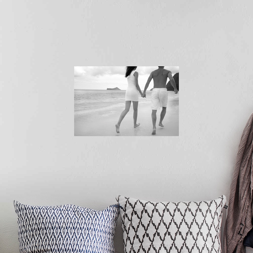 A bohemian room featuring Hawaii, Oahu, Waimanalo, Young Couple Holding Hands Running Together Along The Beach