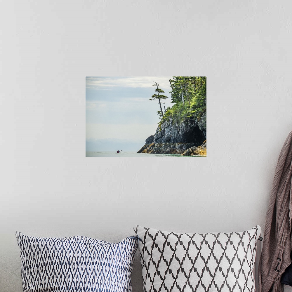 A bohemian room featuring Kayaker paddling through the calm waters in the beautiful scenery of Prince William Sound; Alaska...