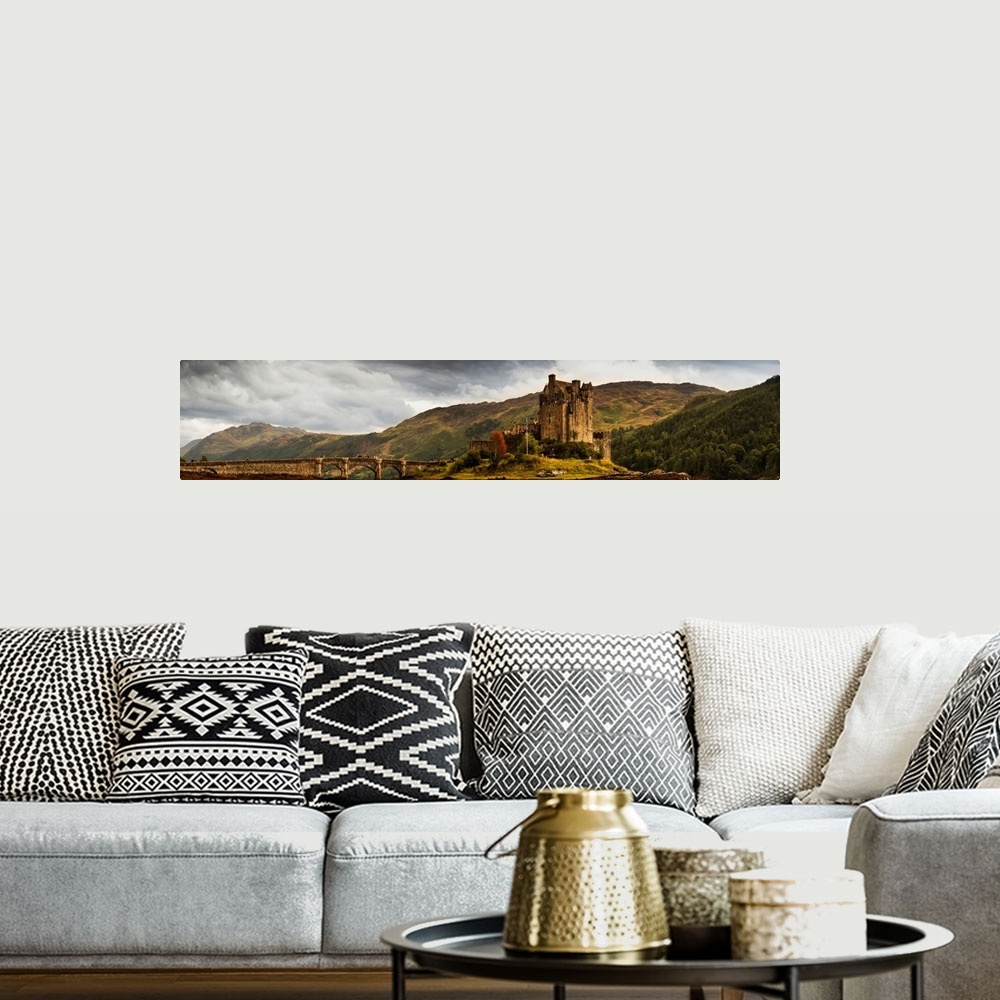 A bohemian room featuring Landscape With A Castle On A Hill And A Stone Bridge Over A River, Scotland