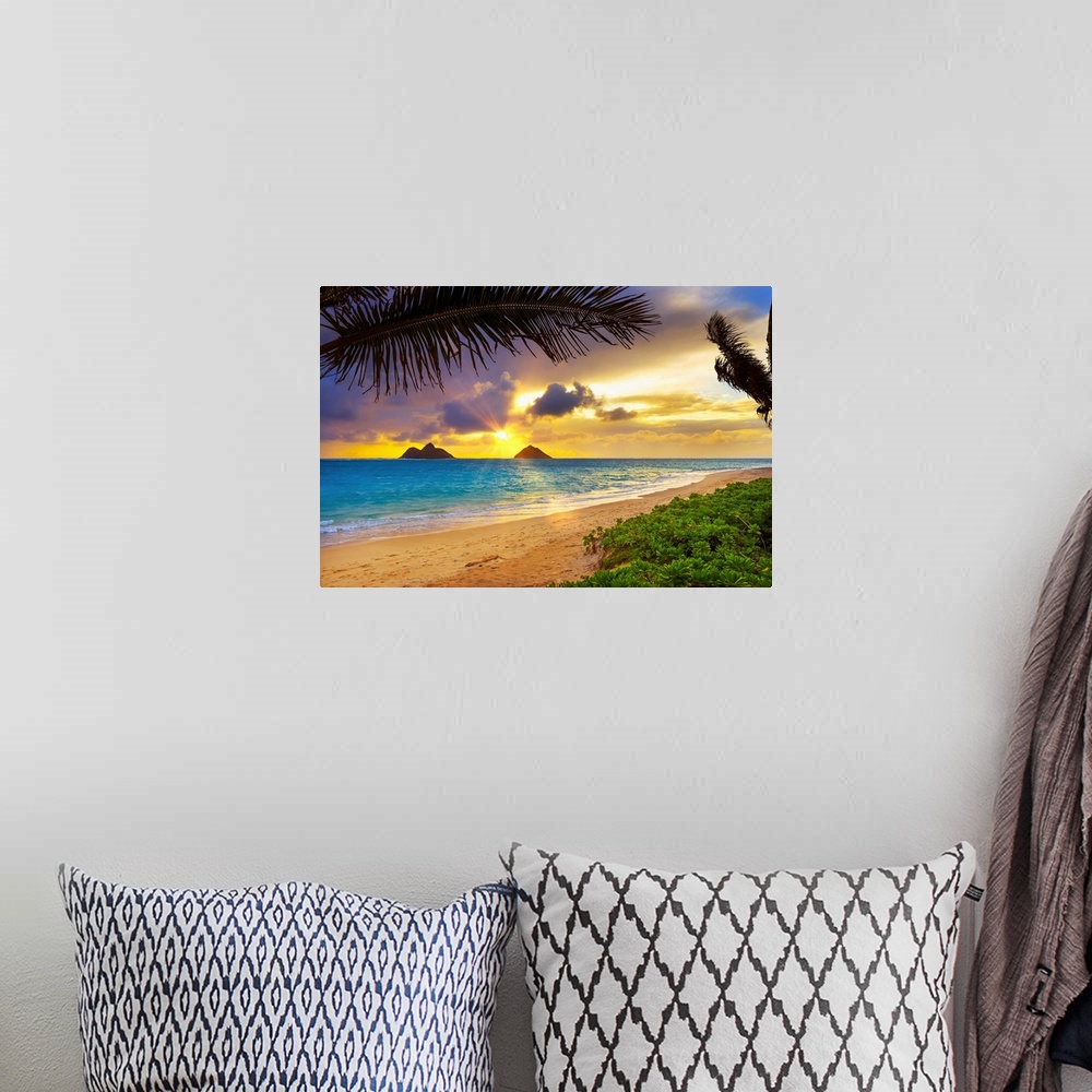 A bohemian room featuring Sunrise viewed from Lanikai Beach with a view of the Mokulua Islands off the coast; Oahu, Hawaii,...
