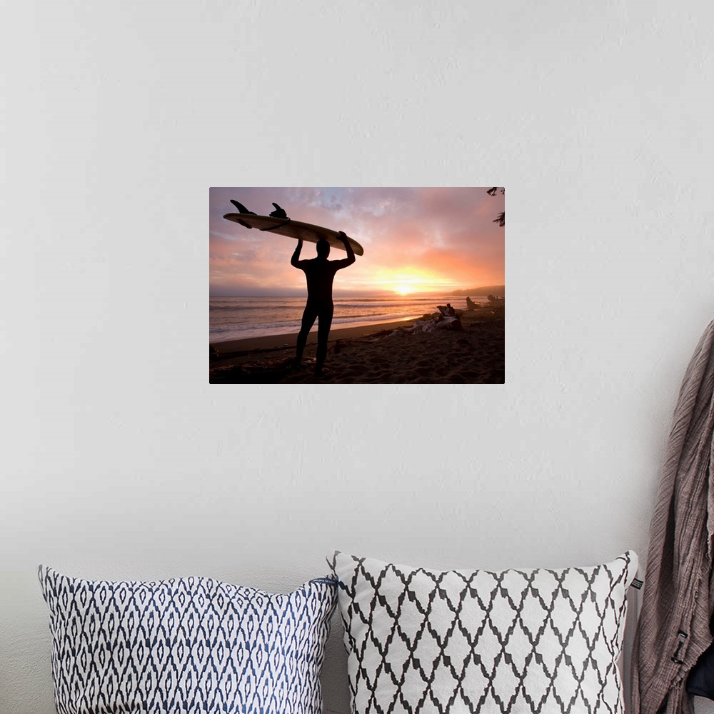 A bohemian room featuring Man Carrying Surfboard, Sombrio Beach, Vancouver Island, BC, Canada