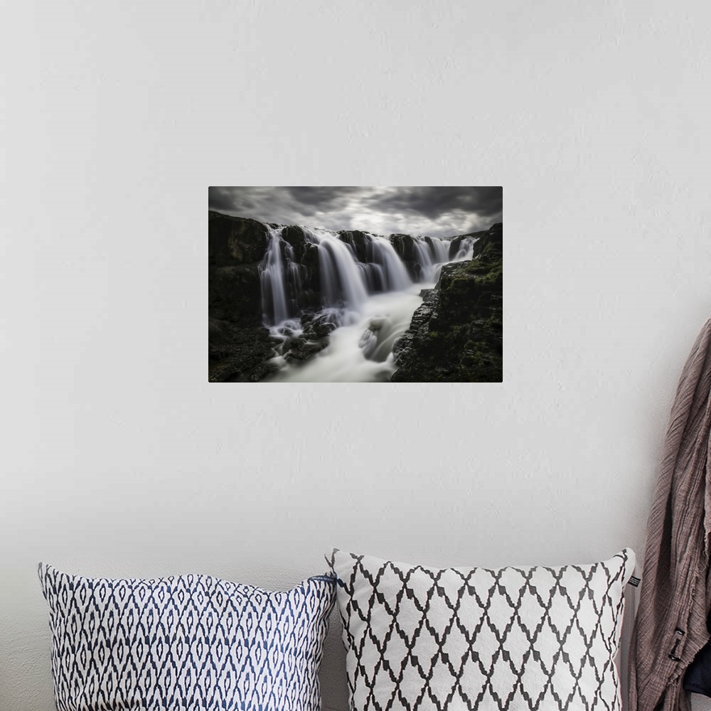 A bohemian room featuring Moody image of waterfalls in the central area of Iceland in a long exposure, Iceland.