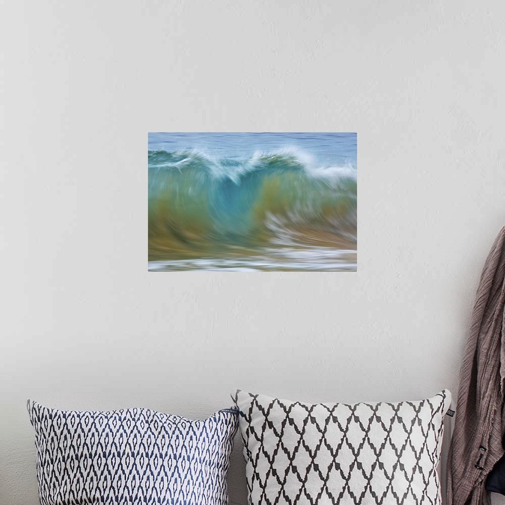 A bohemian room featuring Motion blur of blue rolling waves carrying golden sand at the shore; Kihei, Maui, Hawaii, United ...
