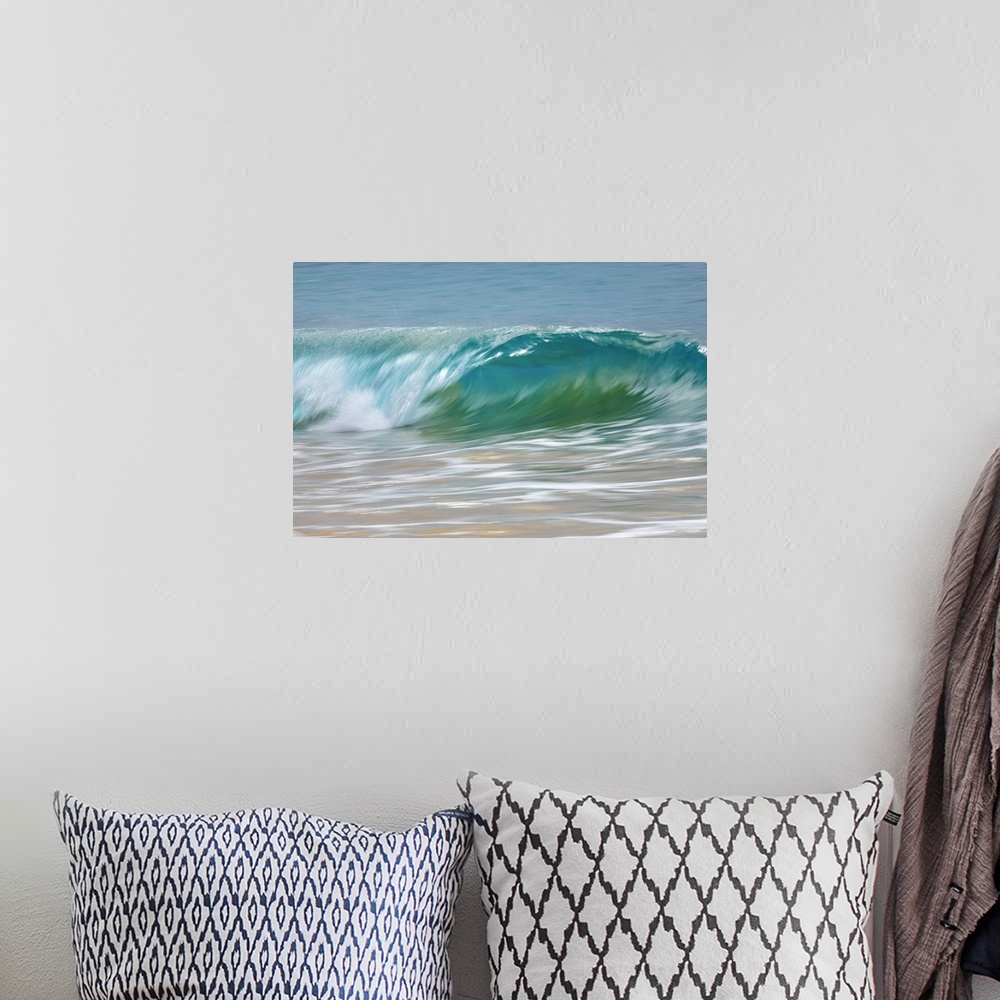 A bohemian room featuring Motion blur of blue rolling waves rolling into the golden sand at the shore; Kihei, Maui, Hawaii,...