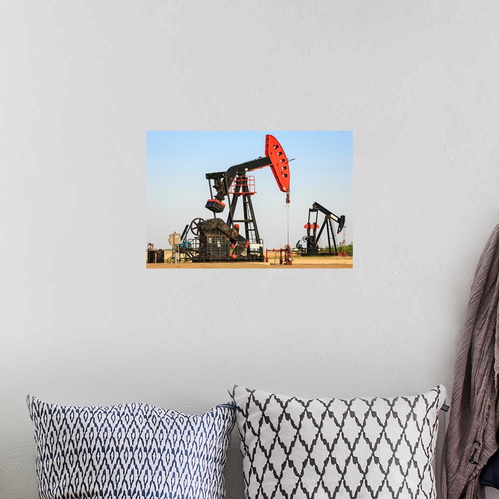 A bohemian room featuring Oil well pump jacks at Bakken Oil Field near Estevan, Saskatchewan, Canada