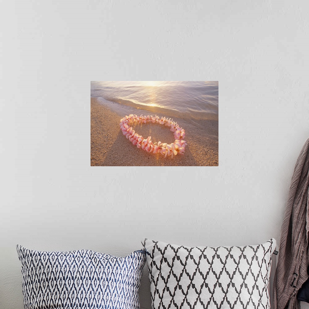 A bohemian room featuring Pale Pink Plumeria Lei In Shoreline Waters With Golden Sunset Reflections