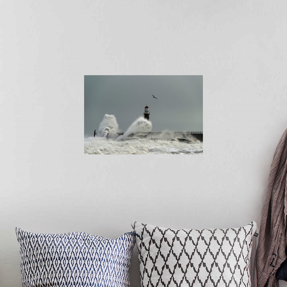 A bohemian room featuring Roker lighthouse and waves from the river ware crashing onto the pier. Sunderland, Tyne and Wear,...