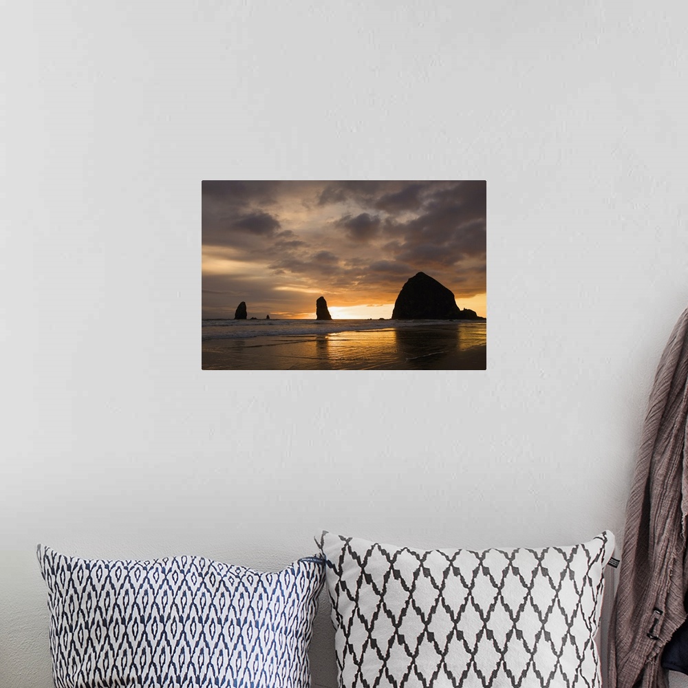 A bohemian room featuring Silhouette Of Rock Formations At Sunset; Cannon Beach, Oregon, USA
