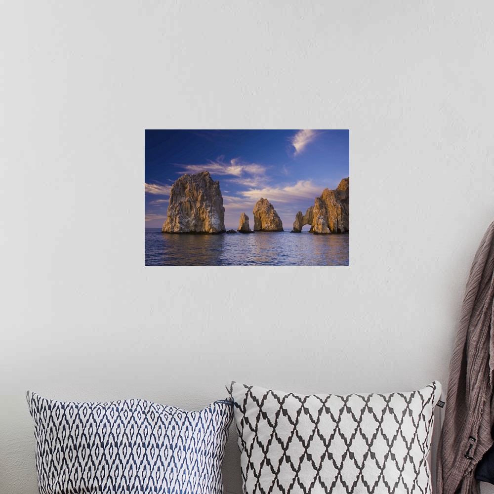 A bohemian room featuring Sunrise on Land's End, Los Arcos rock formations.