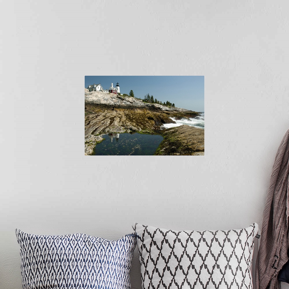 A bohemian room featuring The Pemaquid lighthouse and its reflection in a coastal tidal pool, Pemaquid Point, Maine.