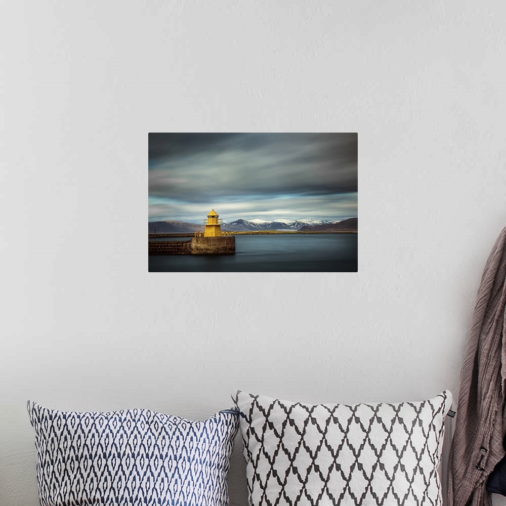 A bohemian room featuring The yellow lighthouse Nordurgardi at Reykjavik harbour.