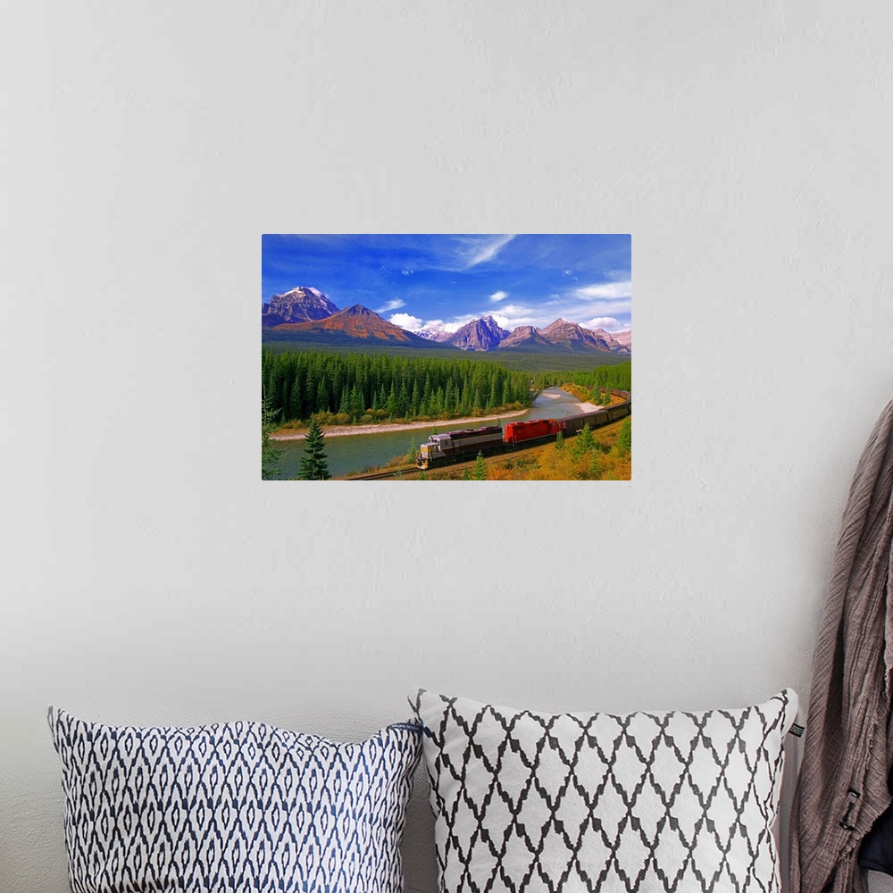 A bohemian room featuring Big canvas photo art of a train running through the Canadian countryside with forests surrounding...