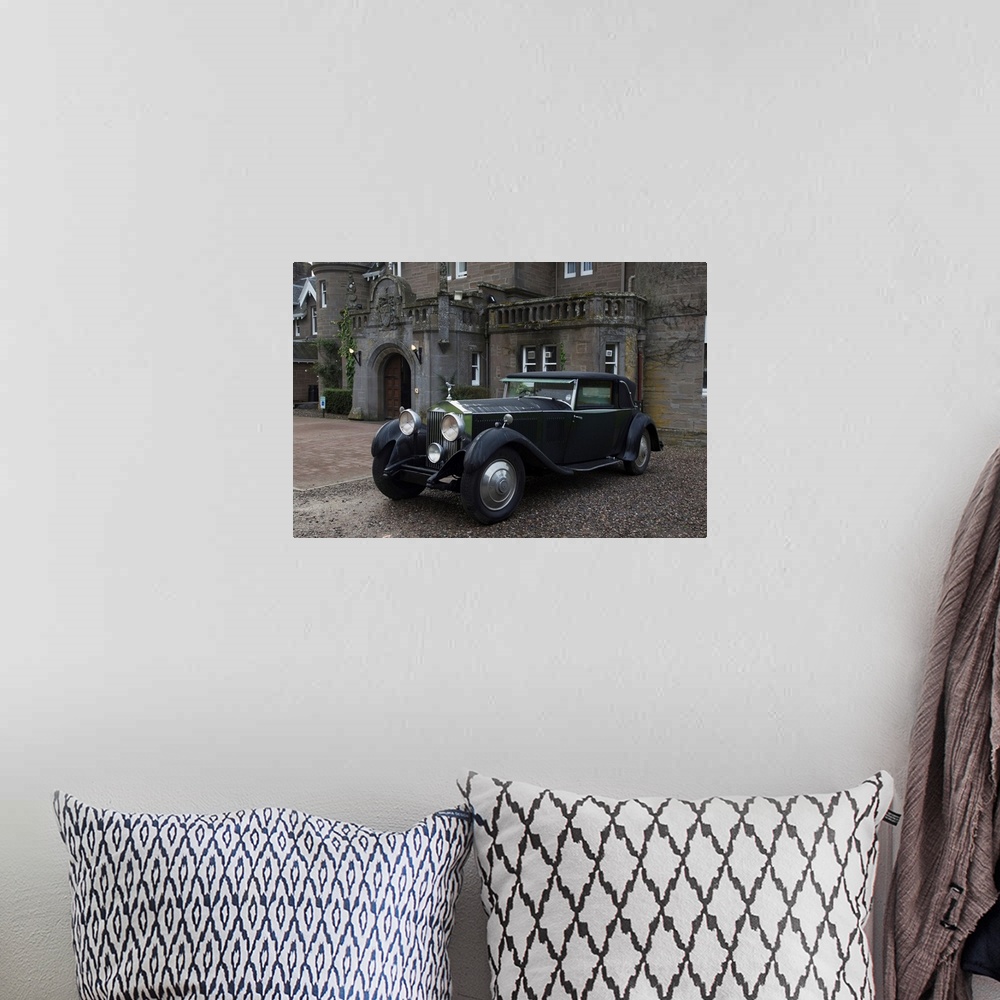 A bohemian room featuring Vintage black car parked outside a large home, Perthshire, Scotland.