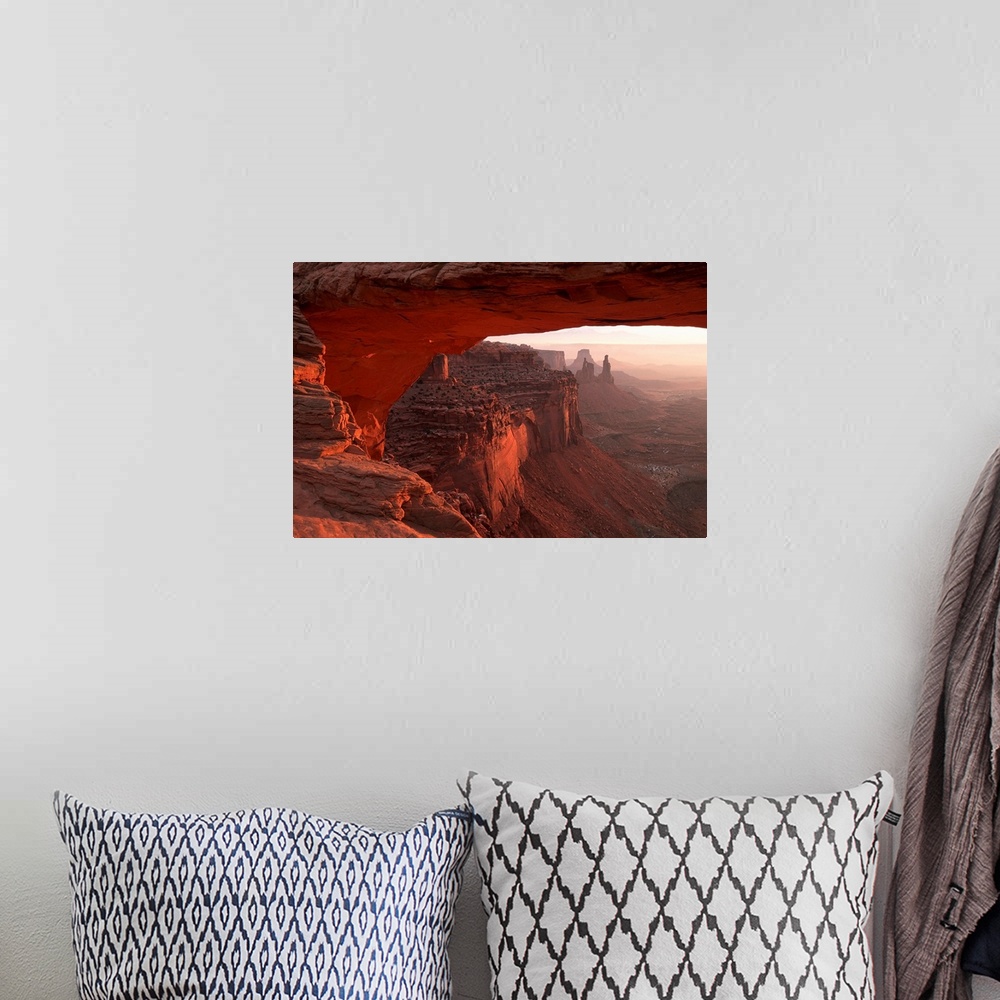 A bohemian room featuring Washer Woman Arch Viewed Through Mesa Arch In Canyonlands National Park; Utah