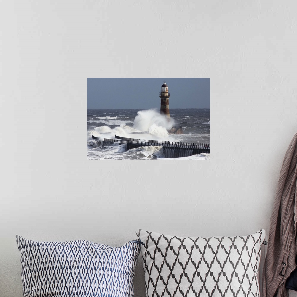 A bohemian room featuring Waves crashing into a lighthouse on the coast, Sunderland Tyne and Wear England
