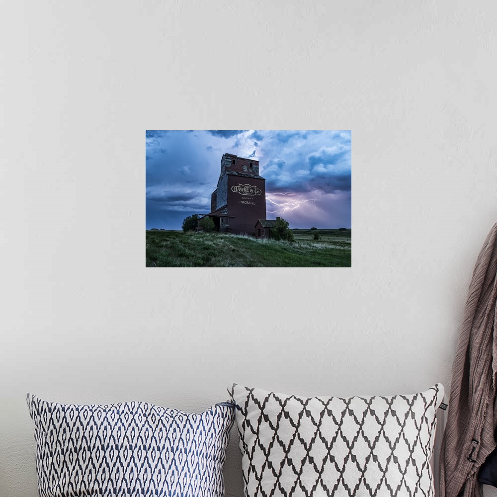 A bohemian room featuring Weathered grain elevator and electrical storm on the prairies; Saskatchewan, Canada