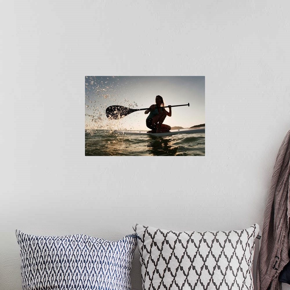 A bohemian room featuring Woman Paddling While On Her Knees On Surf Board, Tarifa, Andalusia, Spain