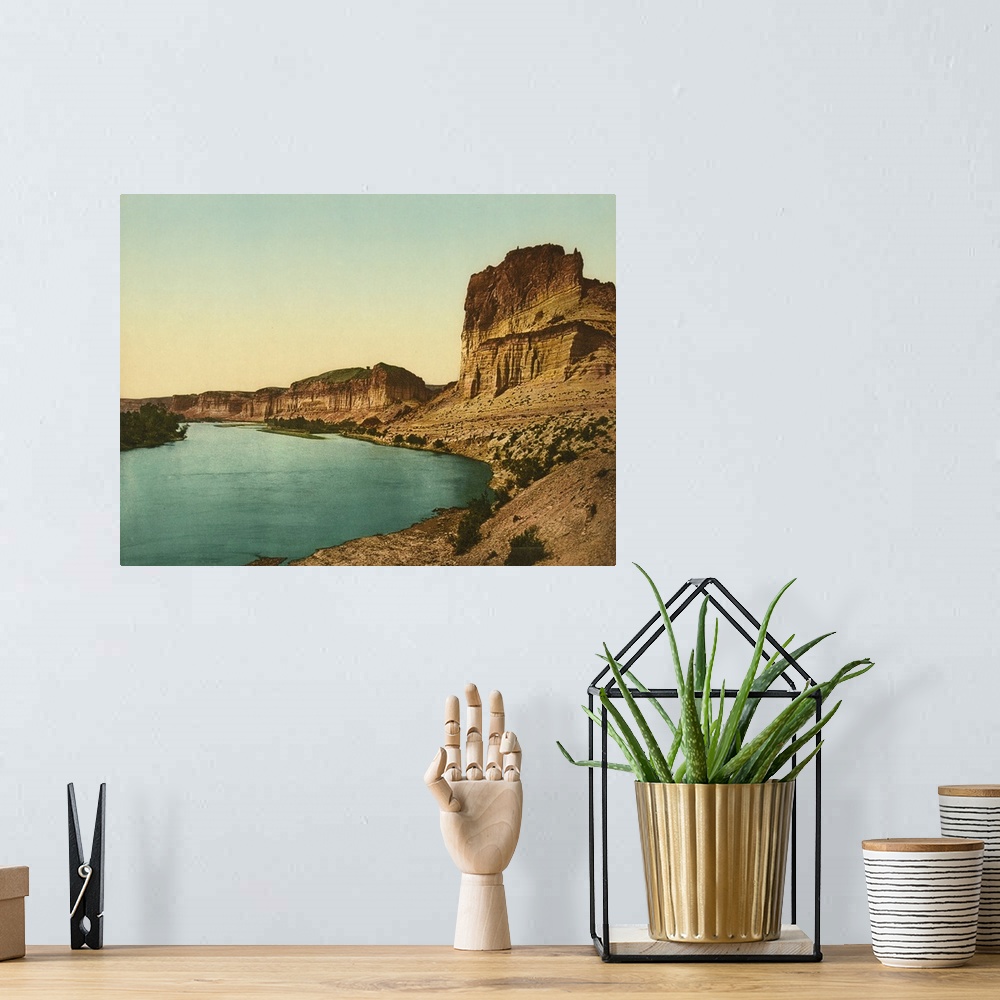 A bohemian room featuring Hand colored photograph of bluffs of the green river.