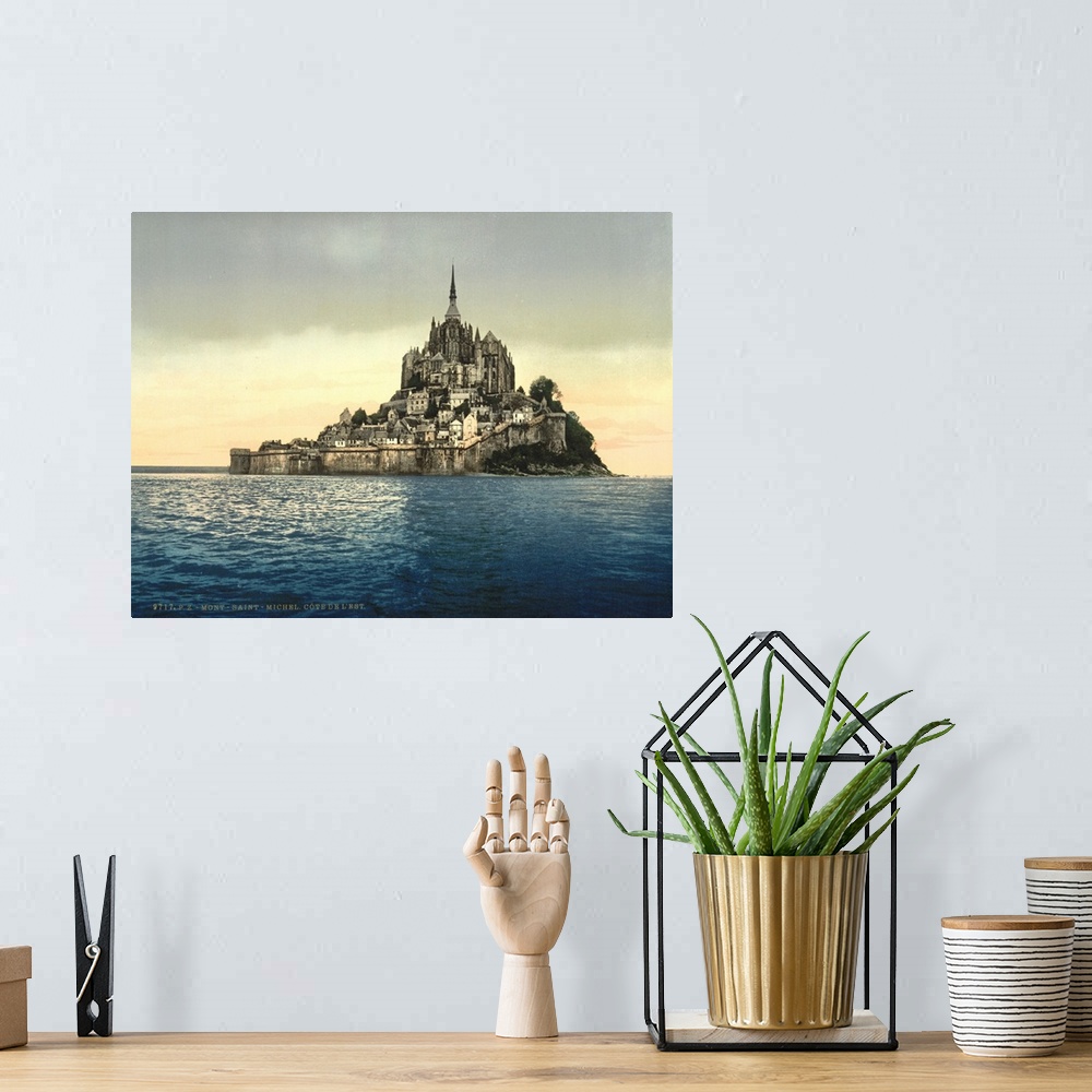 A bohemian room featuring Hand colored photograph of east coast at high water, Le Mont St. Michel, France.