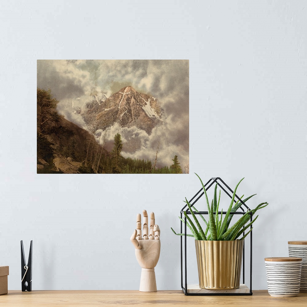 A bohemian room featuring Hand colored photograph of mount of the holy cross in the clouds.