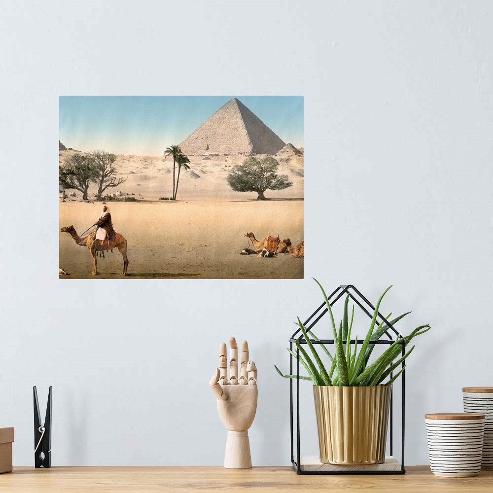A bohemian room featuring Hand colored photograph of resting Bedouins and the grand pyramid, Cairo, Egypt.