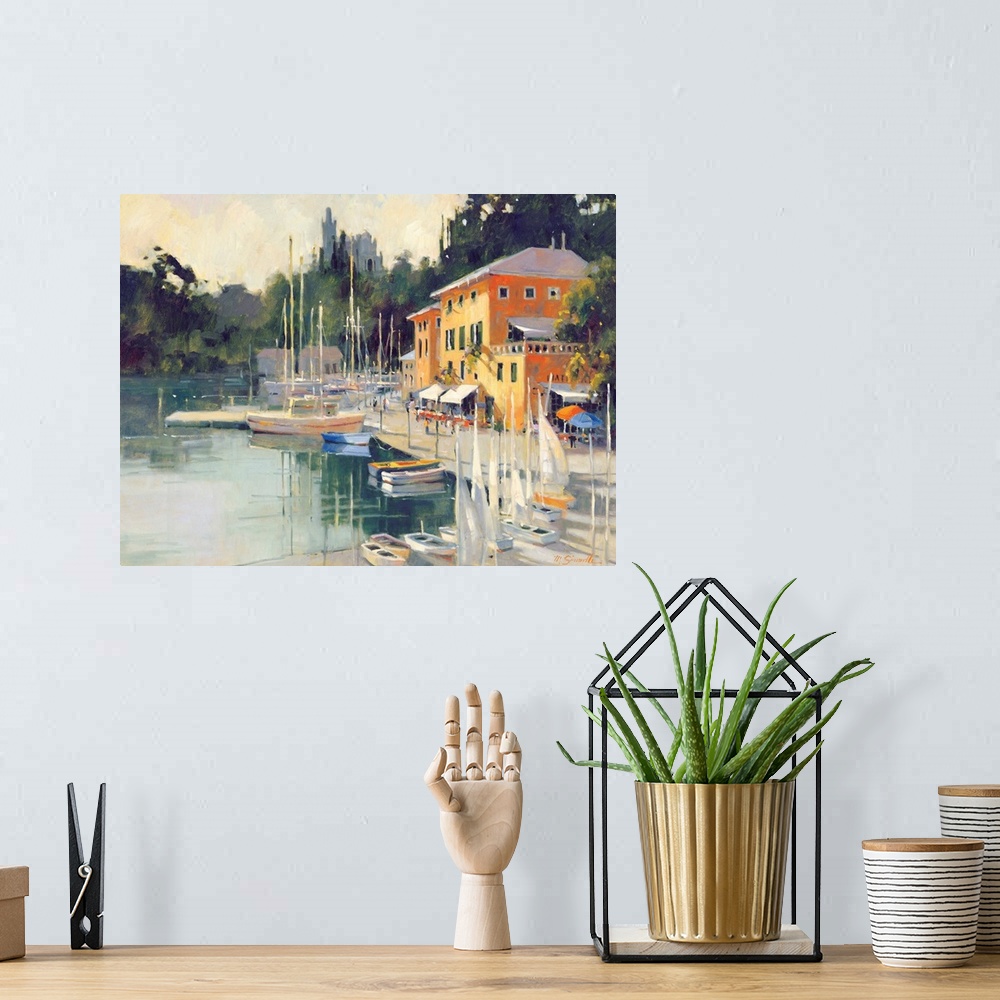 A bohemian room featuring Contemporary painting of a village harbor, with yellow buildings.