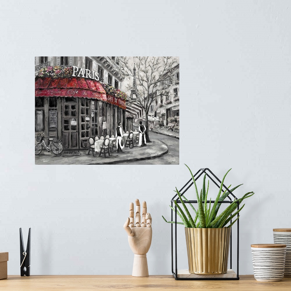 A bohemian room featuring Painting of a street scene in Paris, France, near an outdoor cafe.