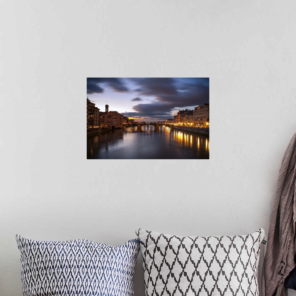 A bohemian room featuring Arno, city with lights reflecting from the bridge
