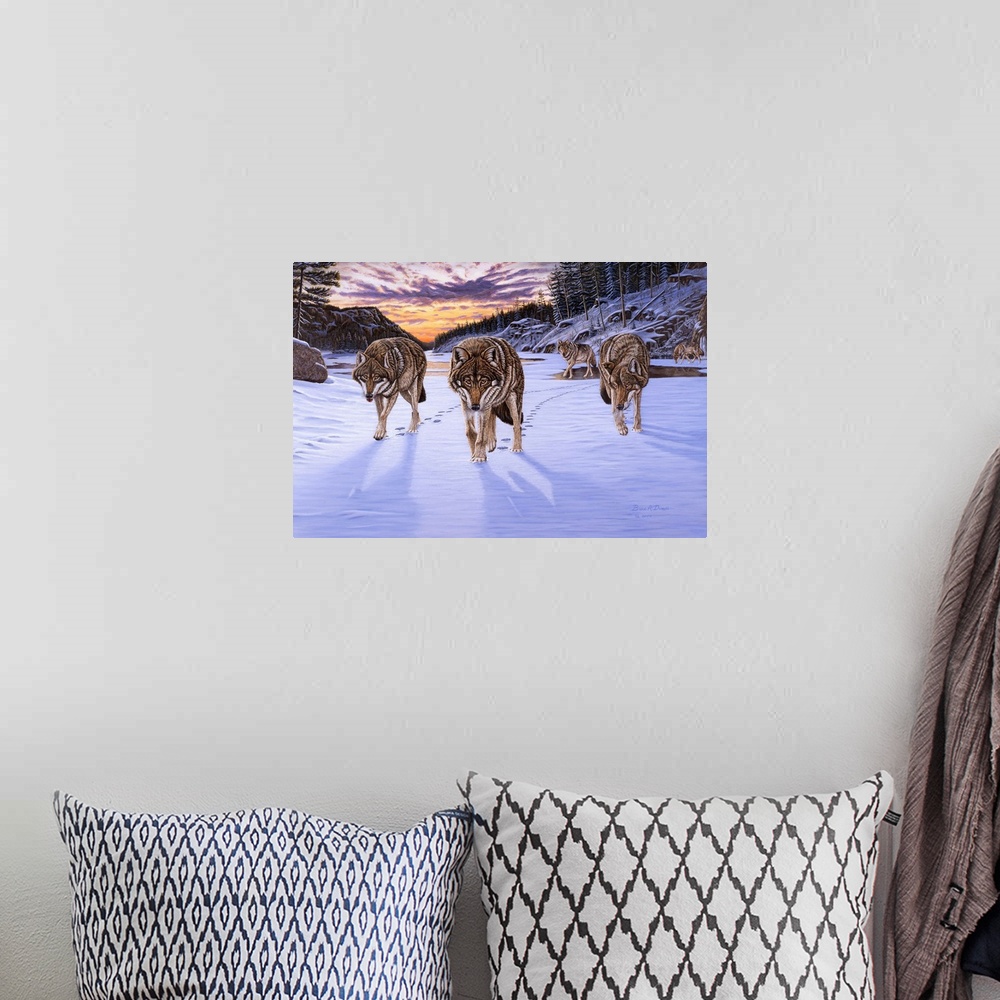 A bohemian room featuring Contemporary artwork of a pack of wolves in wintry scene at sunset.