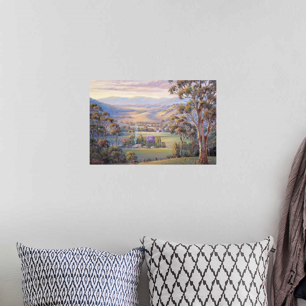 A bohemian room featuring Contemporary painting of an idyllic countryside valley scene at sunset.