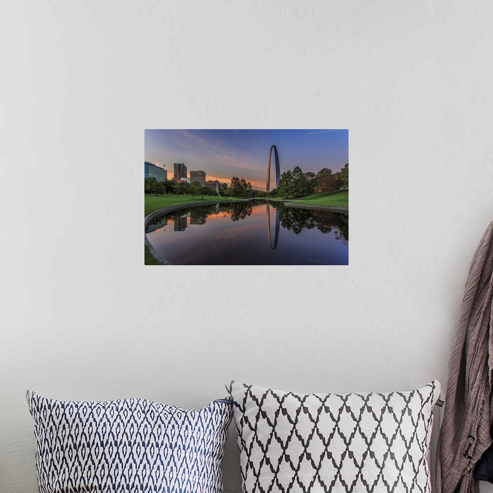 A bohemian room featuring A photograph of a St. Louis Missouri at sunset.