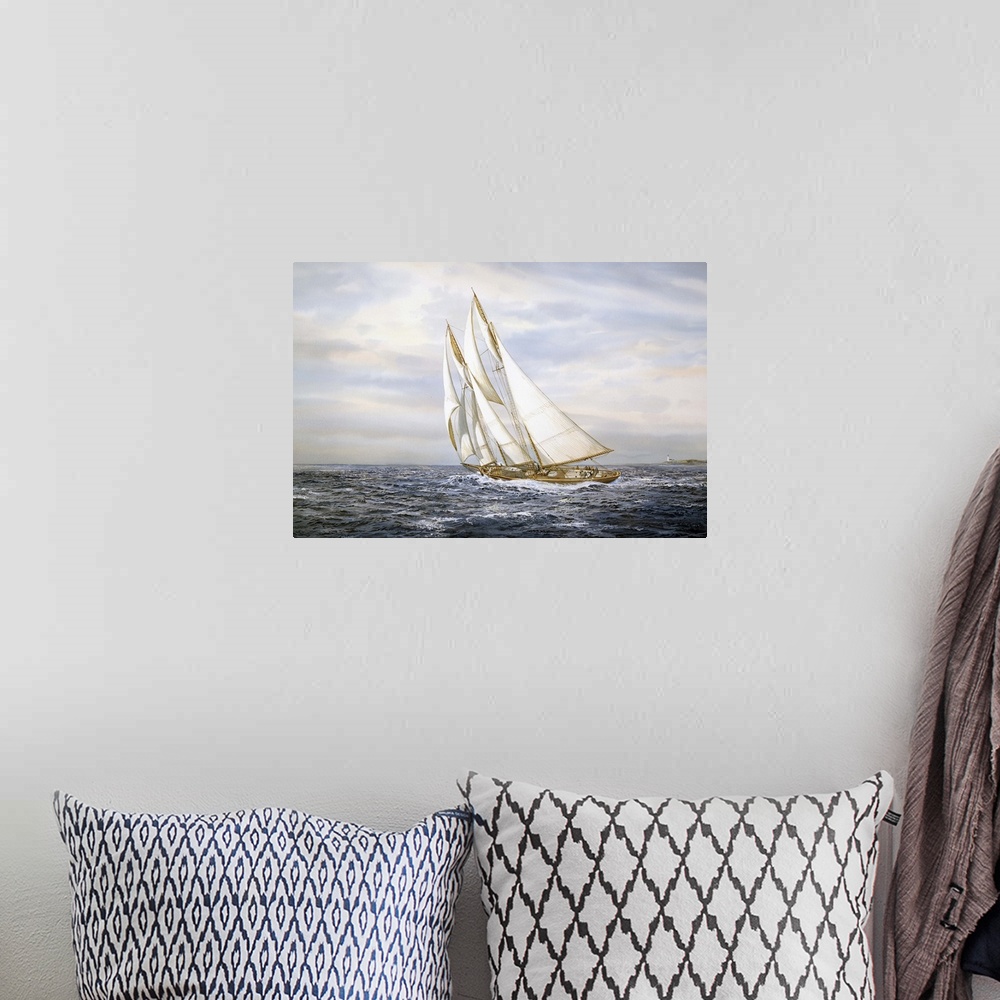 A bohemian room featuring A ship with large sails sailing on ocean.