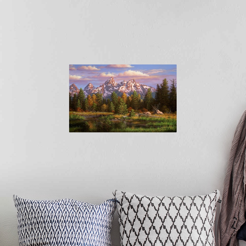 A bohemian room featuring Landscape painting of river and mountains.