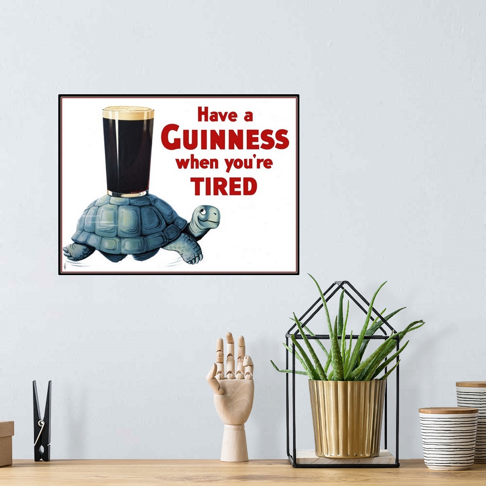 A bohemian room featuring Vintage advertisement for Guinness beer.