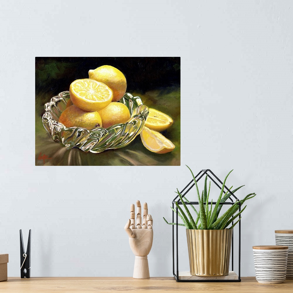 A bohemian room featuring Still life painting of four lemons, one sliced, in a glass dish.