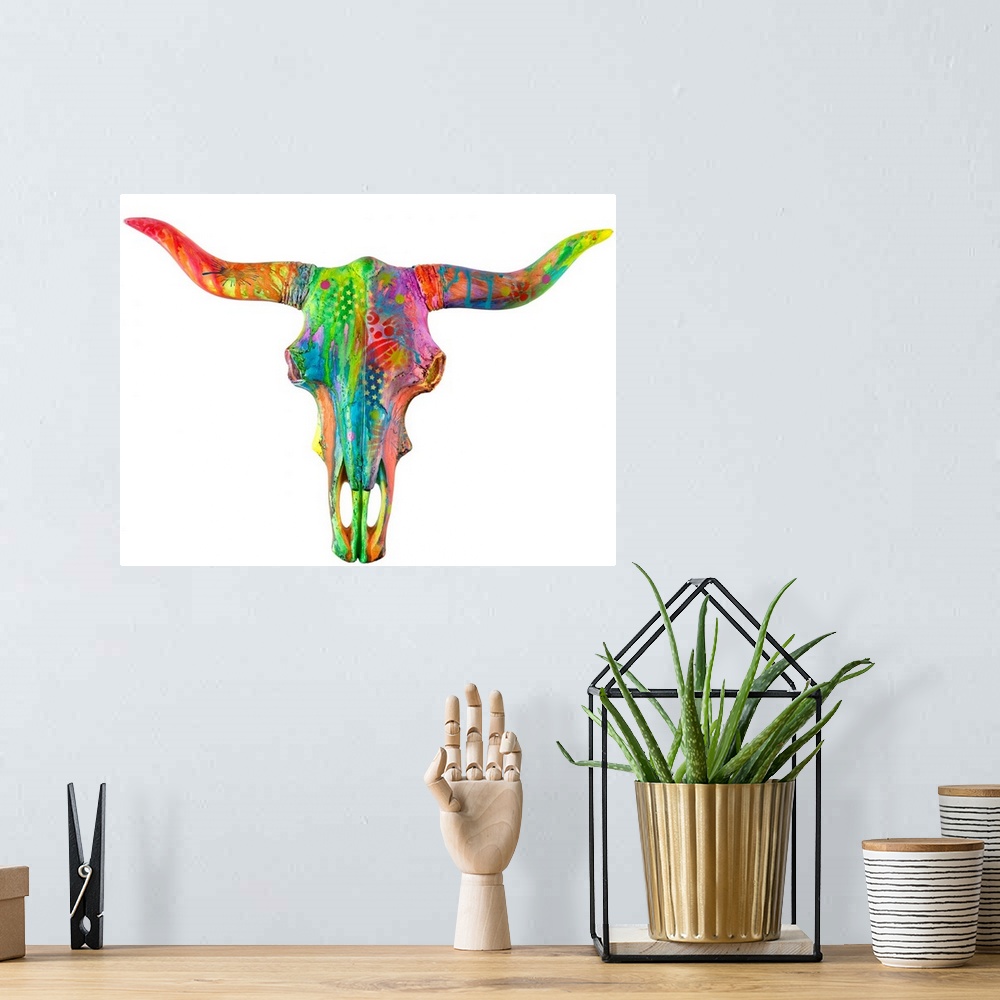 A bohemian room featuring Colorful painting of a longhorn skull covered in abstract designs on a solid white background.