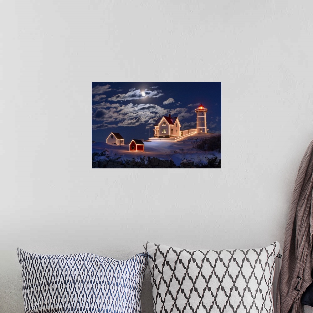 A bohemian room featuring Photograph of a lighthouse and other small building outlined in lights, under a bright moon and c...