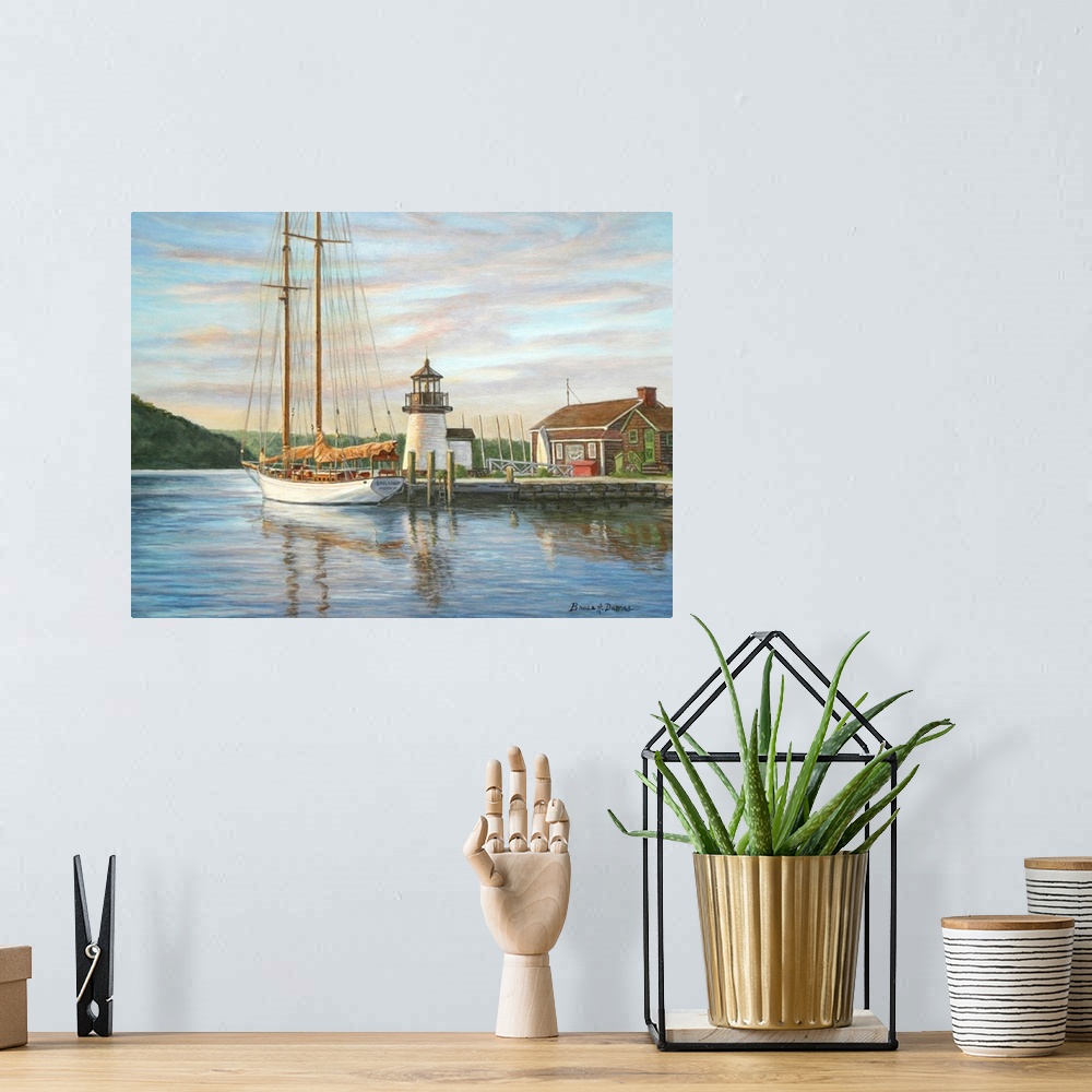 A bohemian room featuring Contemporary artwork of a small lighthouse at a harbor with ships.