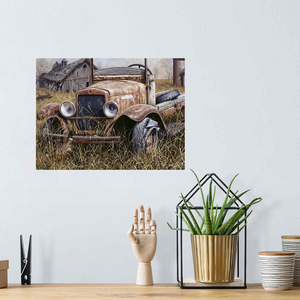 A bohemian room featuring an old truck sitting in a field with an old barn with the roof falling in on one side and an old ...