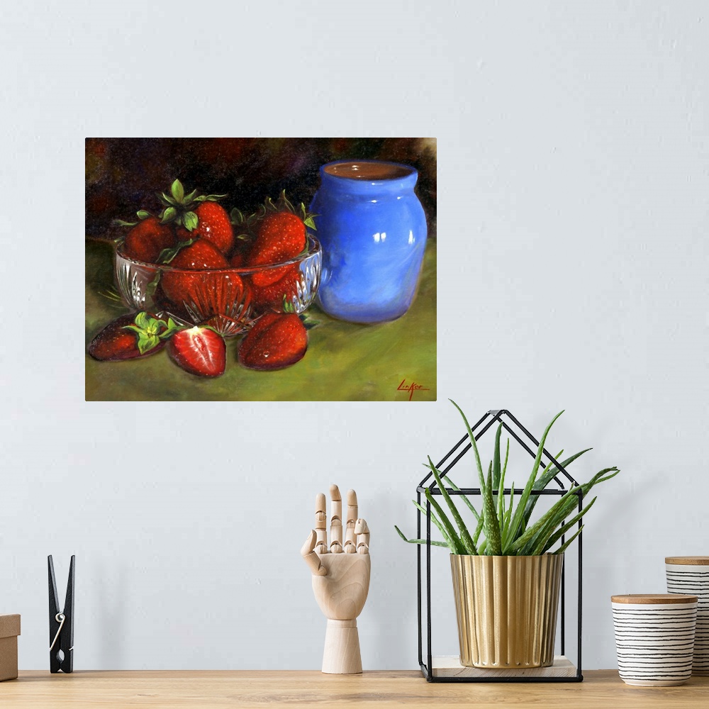 A bohemian room featuring Contemporary still life painting of a dish of strawberries next to a small ceramic vase.