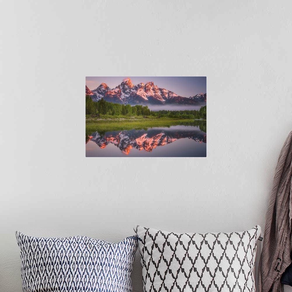 A bohemian room featuring Bright sunlight on the peaks of the Grand Teton mountains.